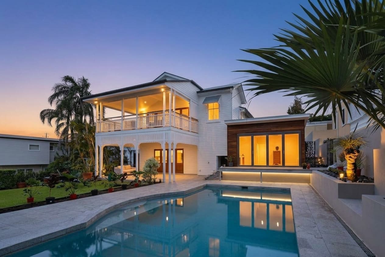 Same house as a classic dusk listing hero with lit windows after AI day to dusk